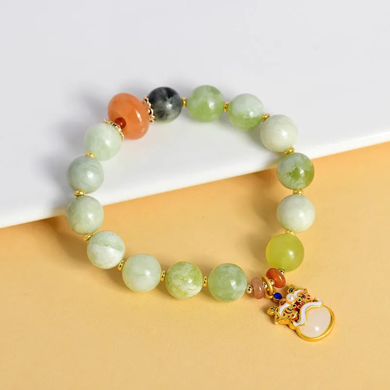 Green milk-in-water Xingshi jade geometric pendant on an adjustable string bracelet