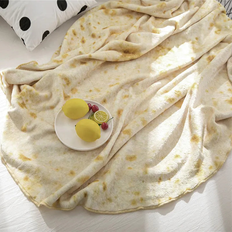 Round burrito design blanket in coral fleece flannel with tortilla print, folded to show size