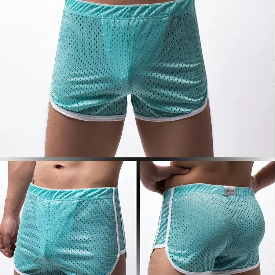 Men's knitted cotton three-point boxer shorts in black, grey, blue, and white colours laid flat.