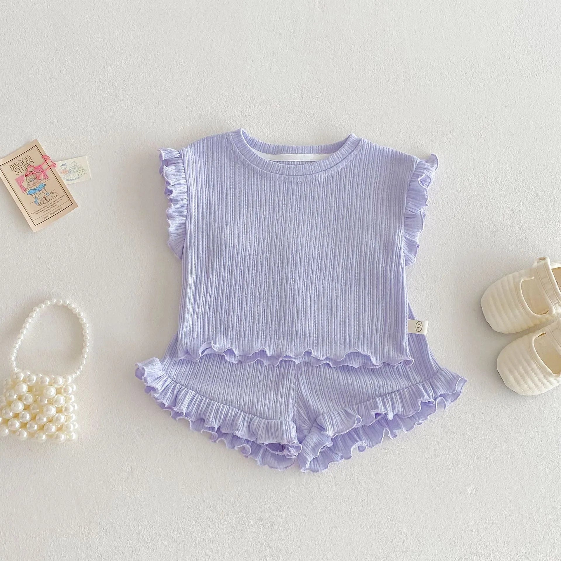 Baby girl two-piece cotton shorts set in light beige with wooden ear vest top and matching shorts