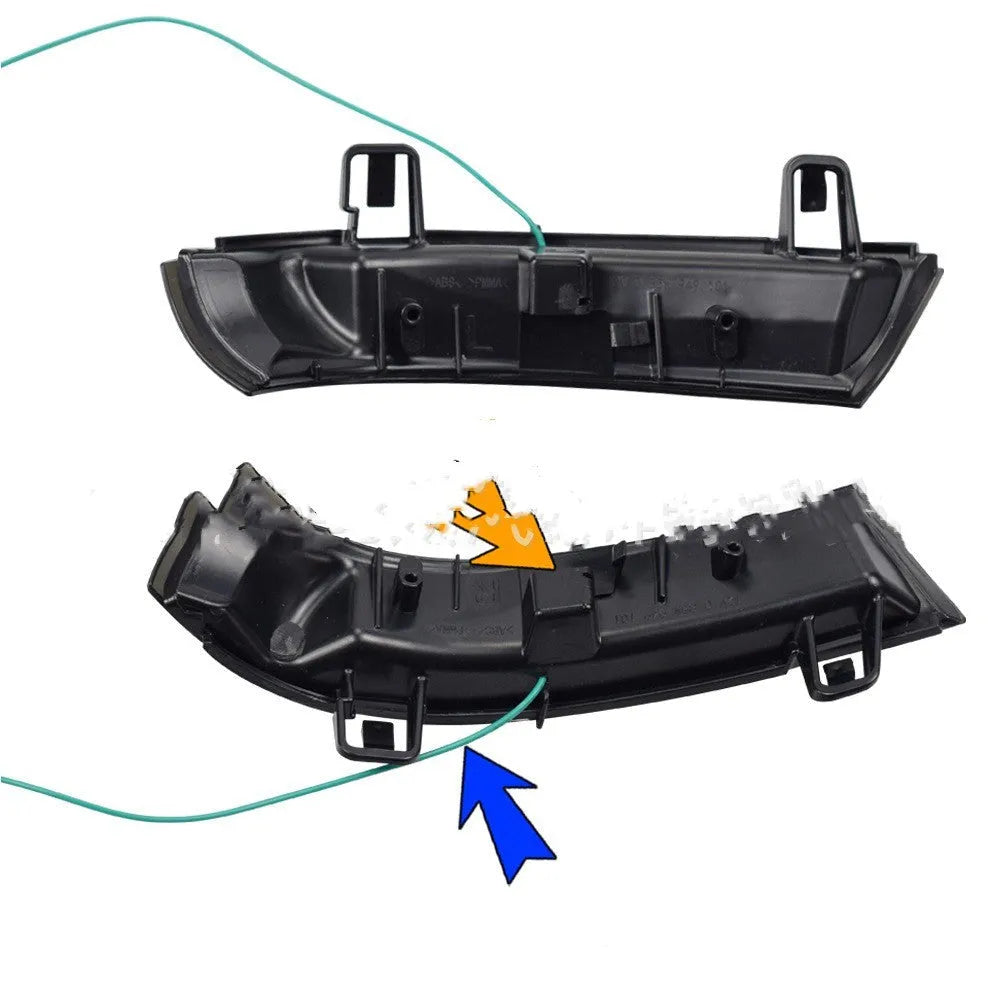 Volkswagen Golf MK5 front end with dynamic sequential amber and blue turn signal lights illuminated.