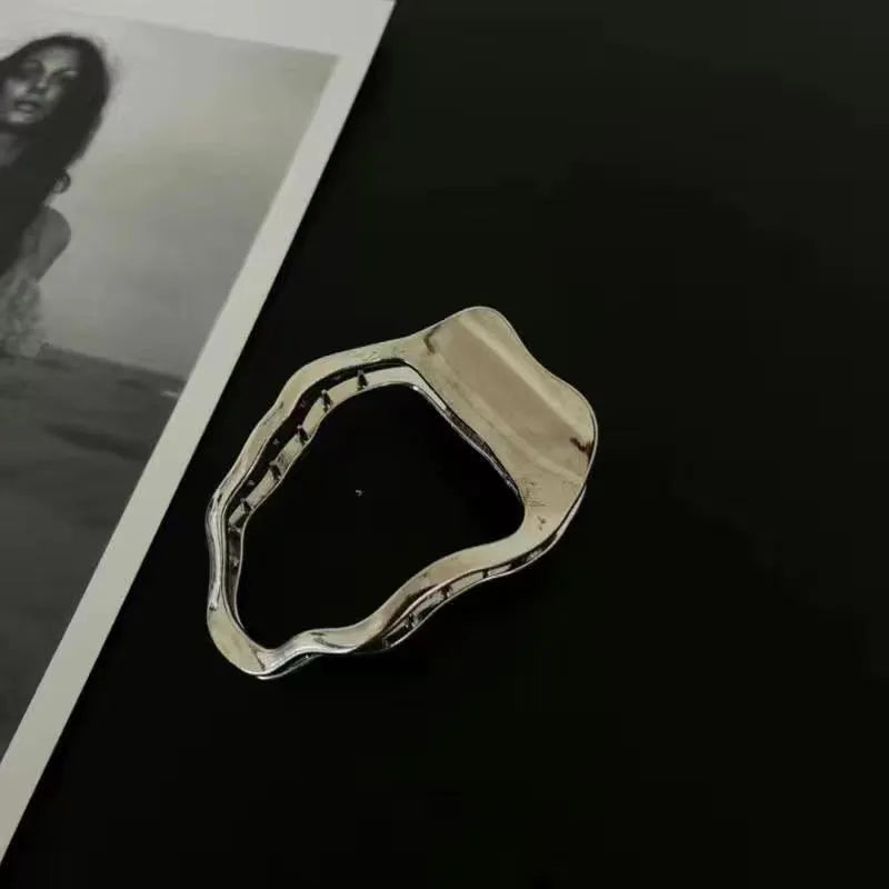 Gold and silver zinc alloy hair clip barrettes in arc, square, and triangle shapes.