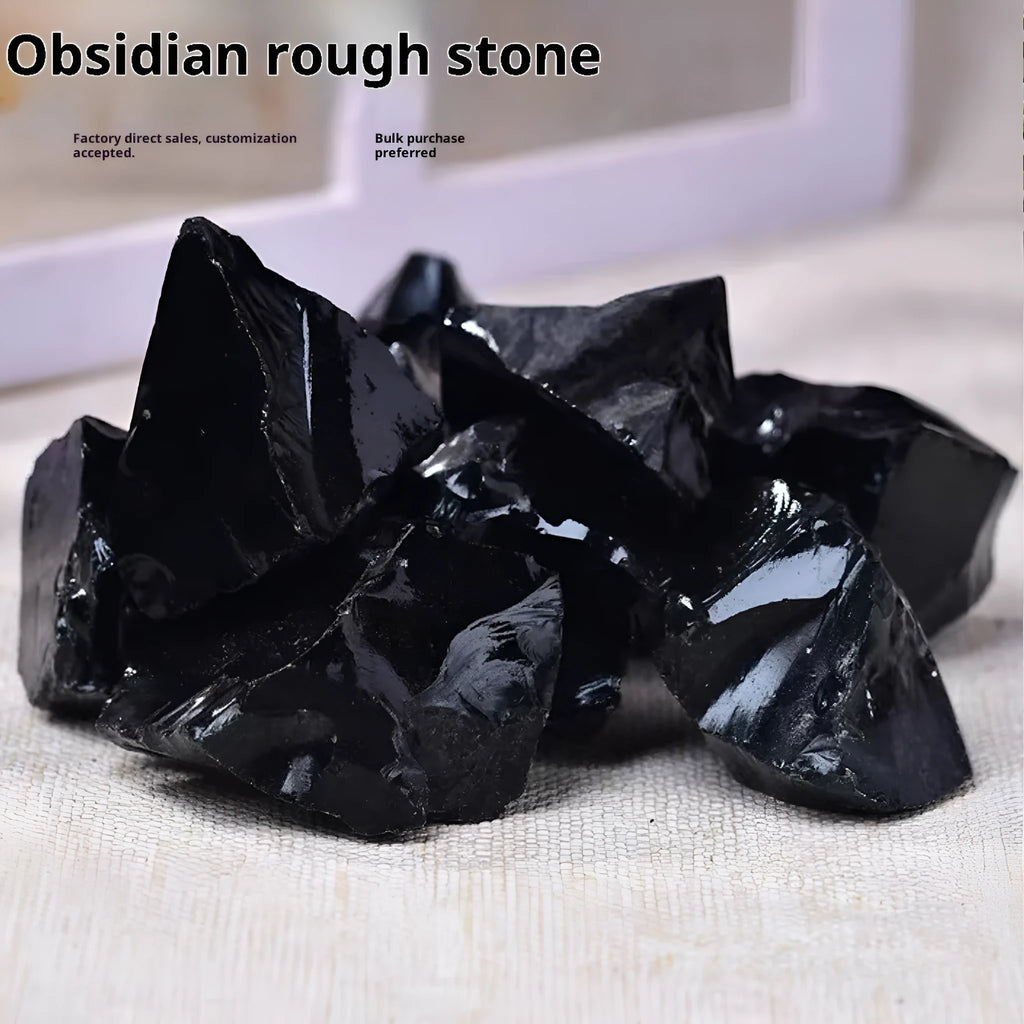 Natural black obsidian rough gravel stones in a pile, size 2-3cm each
