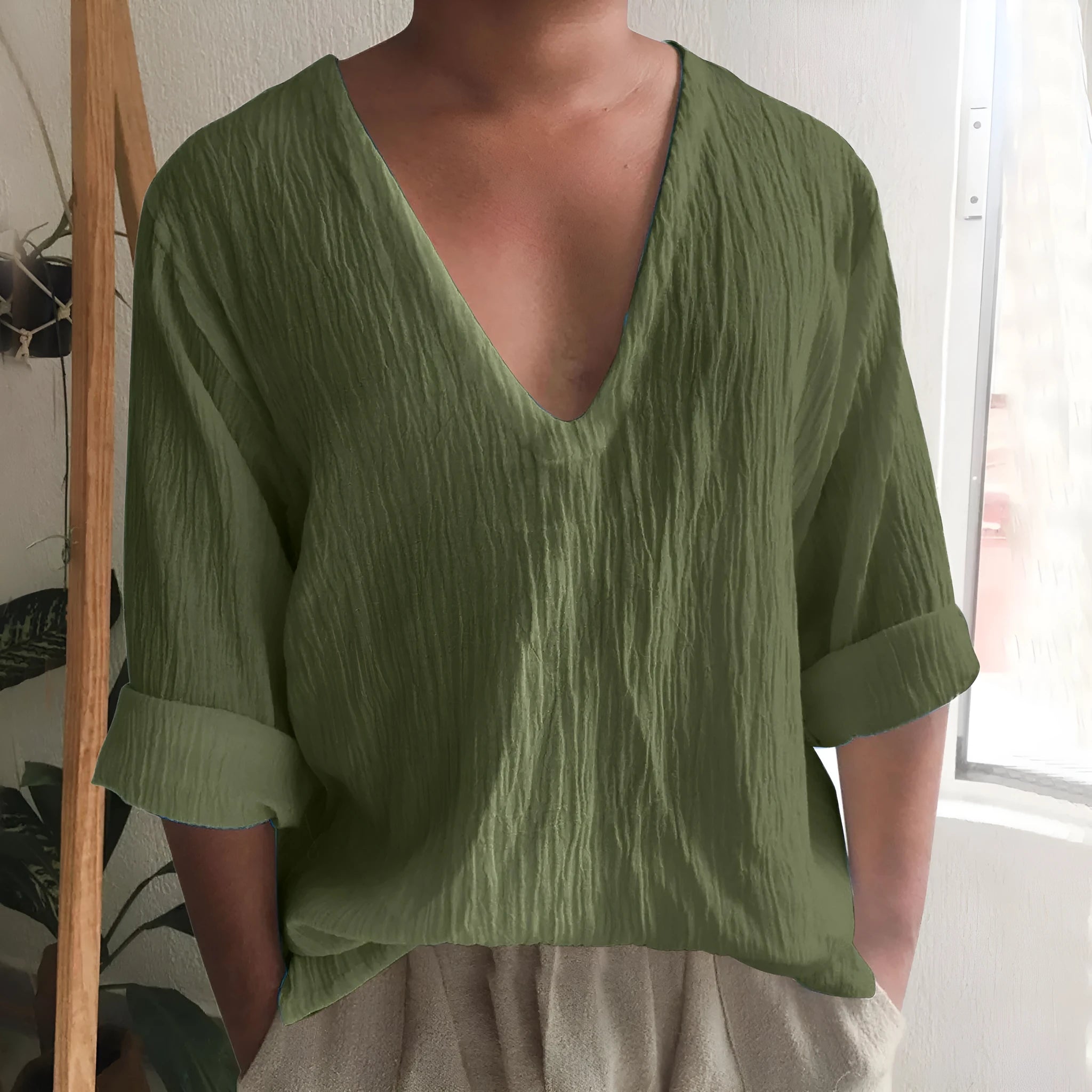Men's solid colour long sleeve V-neck T-shirt in washed cotton fabric.