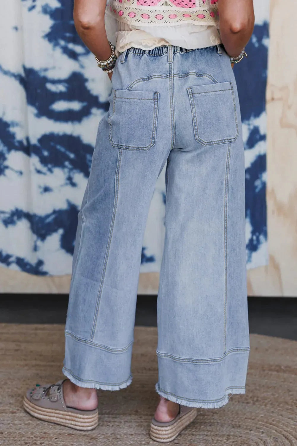 Beau blue women's wide leg denim trousers with a drawstring waist and raw hem seam detail