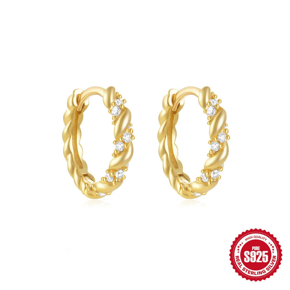 Sterling silver geometric stud earrings with round diamond accents in gold and silver electroplated finishes