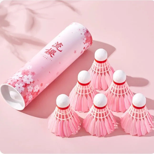 Pink goose feather badminton shuttlecocks in 6 pack on court background