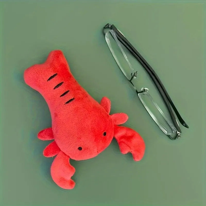 Red lobster-shaped squeaky plush dog toy with bite-resistant construction for small and medium breeds