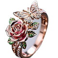 Colourful adjustable butterfly ring with floral details and a dripping oil finish.
