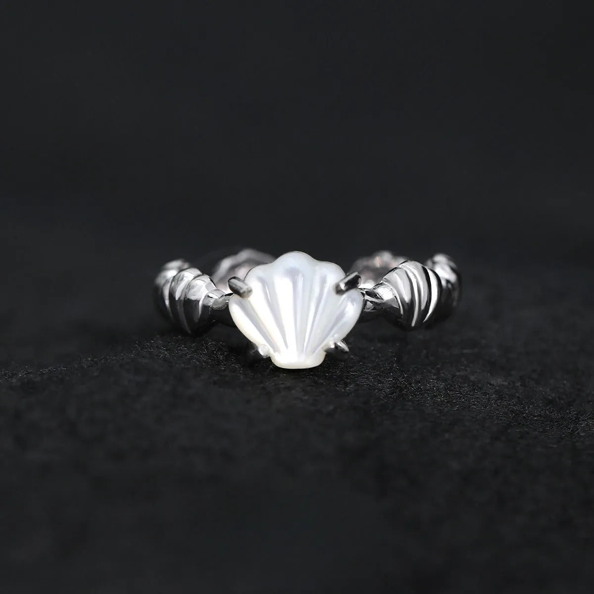 Adjustable sterling silver ring with shell elements and electroplated gold finish