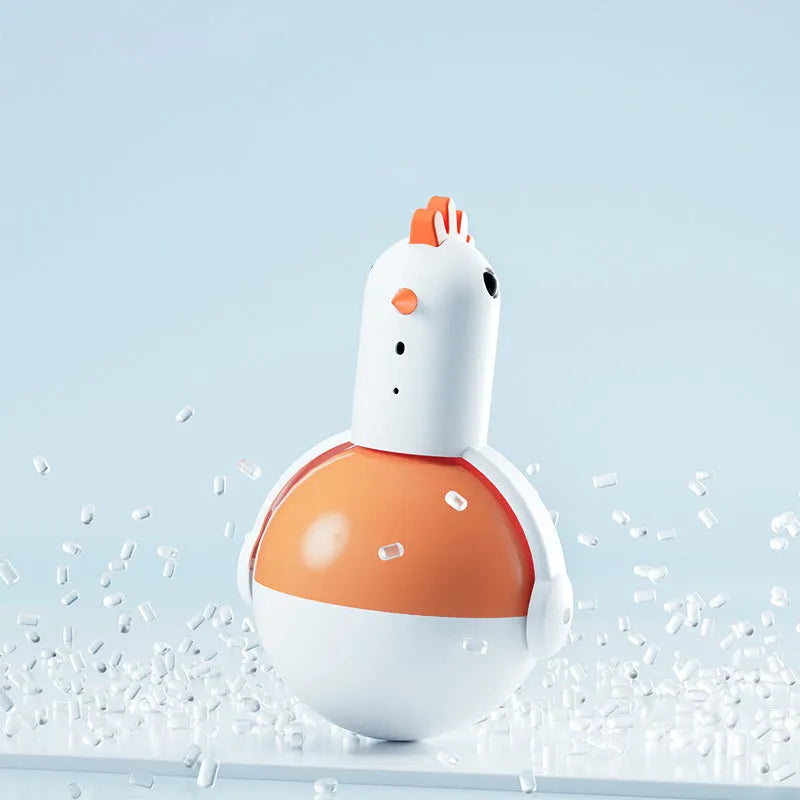 Green and orange electric cat toy chicken with laser light and sound features on a floor