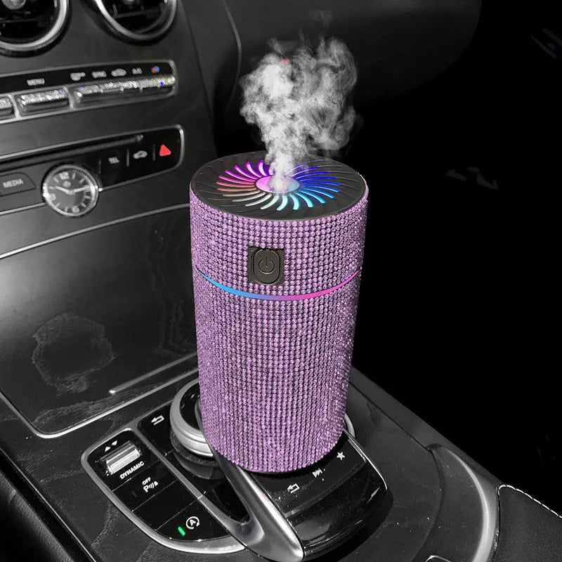 Compact white car air humidifier and purifier with USB cable on a car dashboard