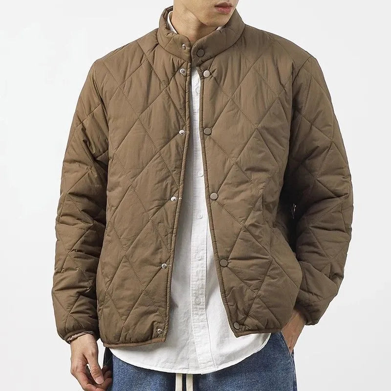 Men's black diamond lattice patterned winter jacket showing lengthened design and medium thickness padding