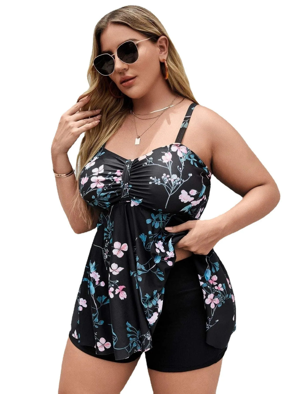 Women's one-piece floral print swimsuit with split colour design on a mannequin, showing high elasticity polyester fabric.