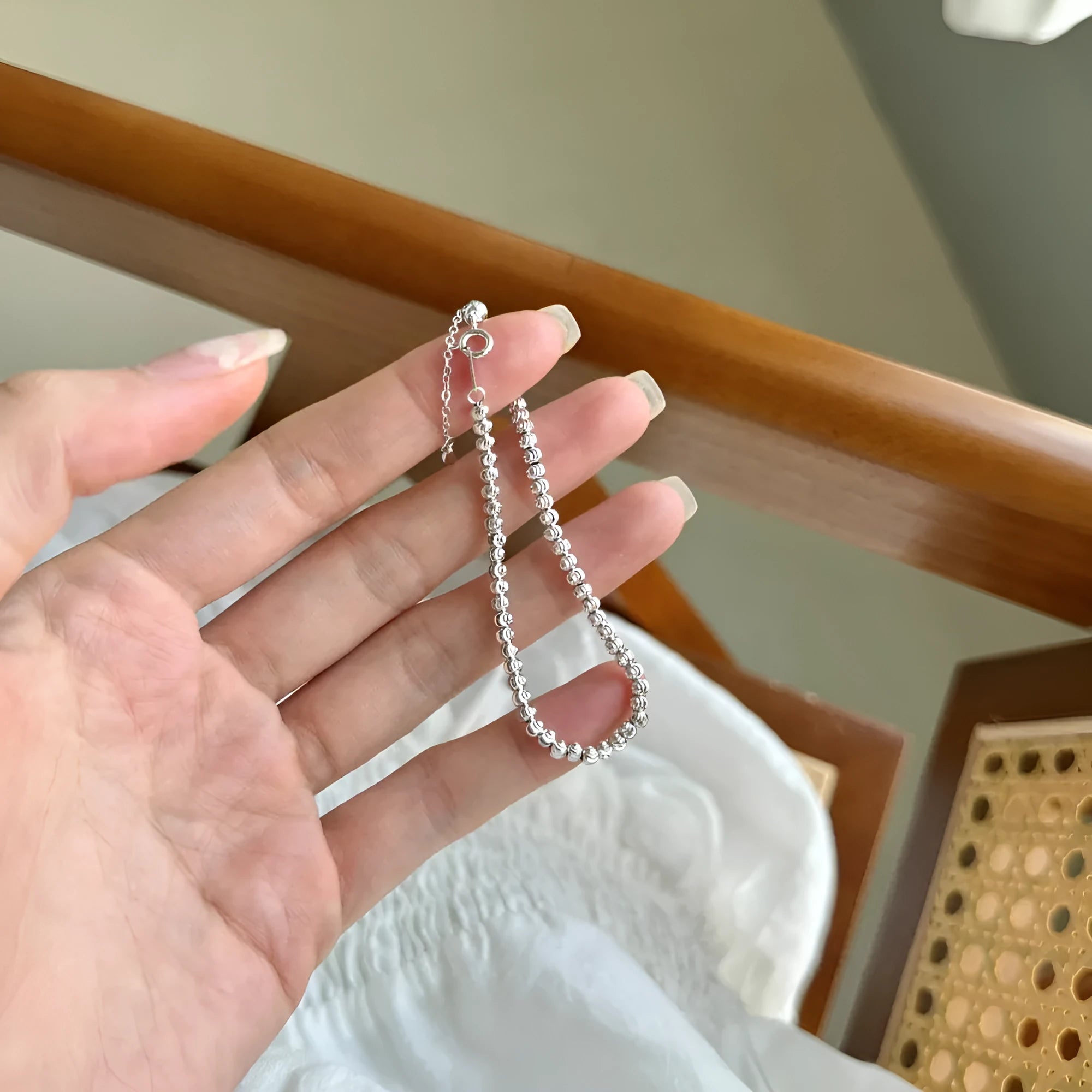 S925 sterling silver bracelet for women with crescent and round beads in geometric design, platinum finish, on white background