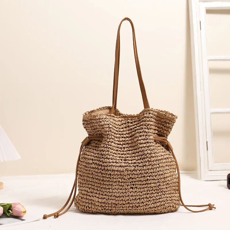 Large capacity paper straw drawstring shoulder bag in beige with double straps and inner pocket
