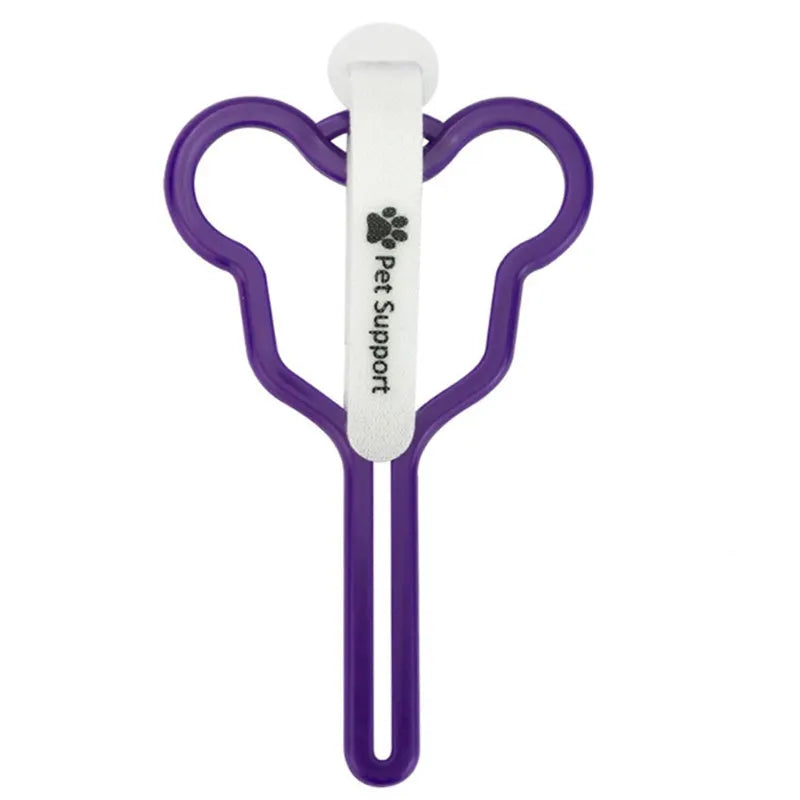 A coloured hands-free dog poop bag holder with a fixed clip and velcro strap attached to a dog leash.