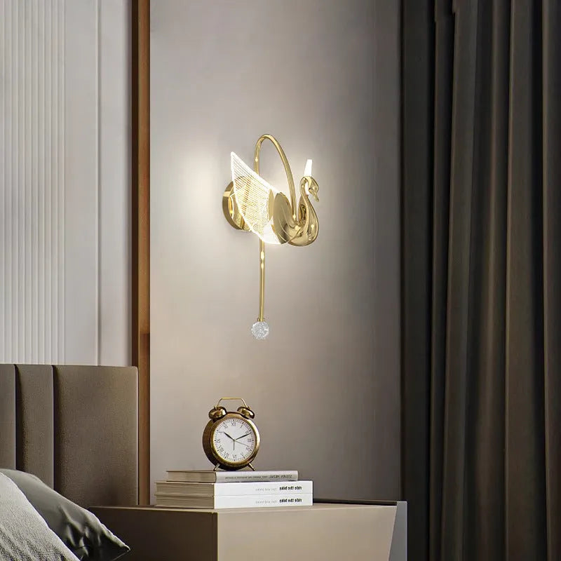 Gold swan-shaped wall lamp with acrylic shade and iron construction for bedroom lighting
