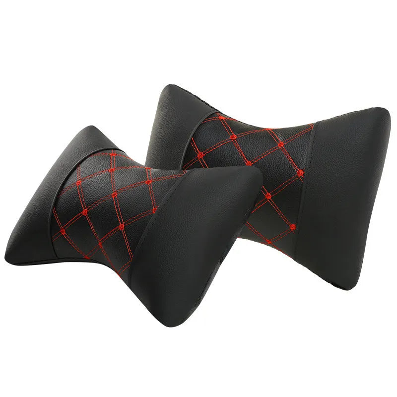 Black quilted diamond pattern car headrest pillow with coloured stitching for neck support.