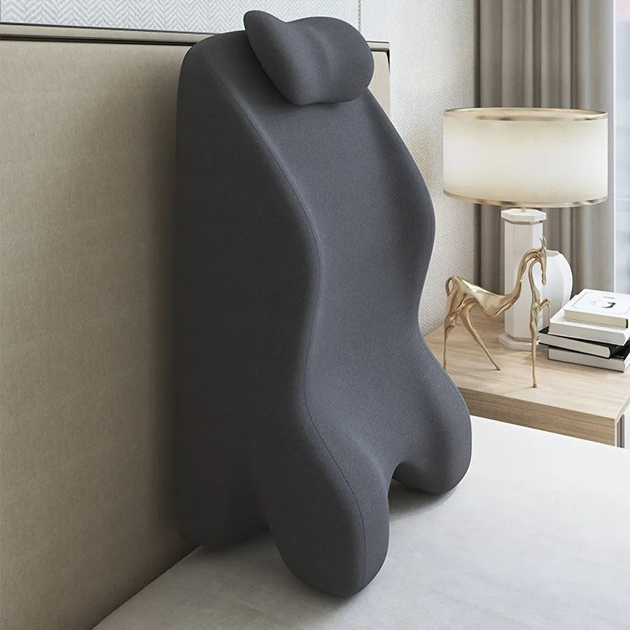 A stomach sleeper pillow designed for lying on your front, shown in blue, dark grey, green, and light grey colour options.