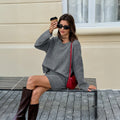 Women's solid grey wool blend knit sweater and skirt suit with long sleeves, shown as a two-piece casual set