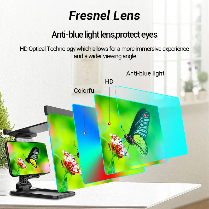Black folding mobile phone screen magnifier with detachable phone holder on a desk.