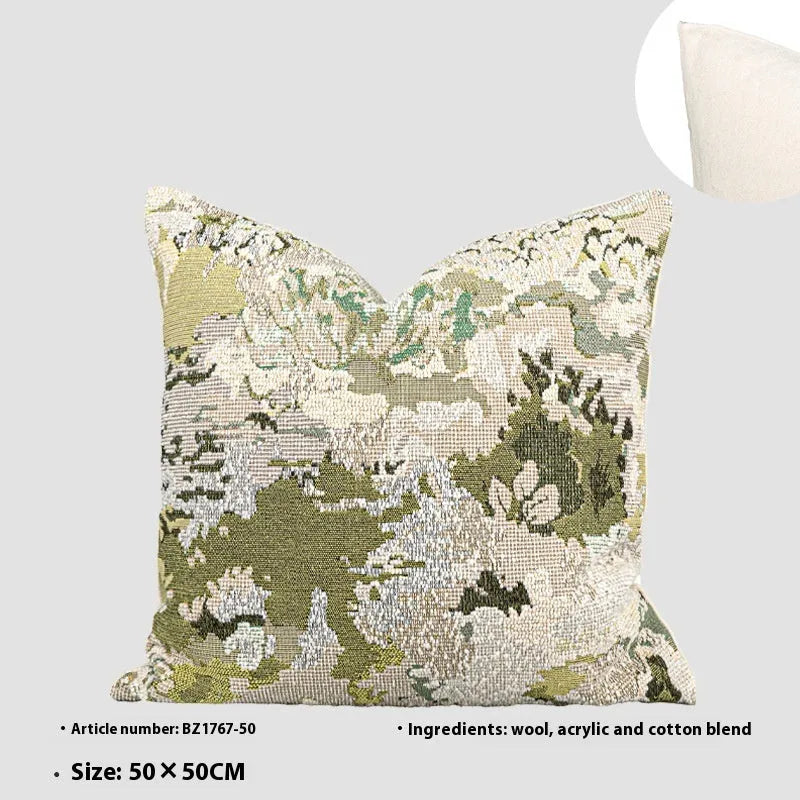 Green abstract floral pattern on a wool blend cushion cover, shown in square and lumbar pillow sizes.