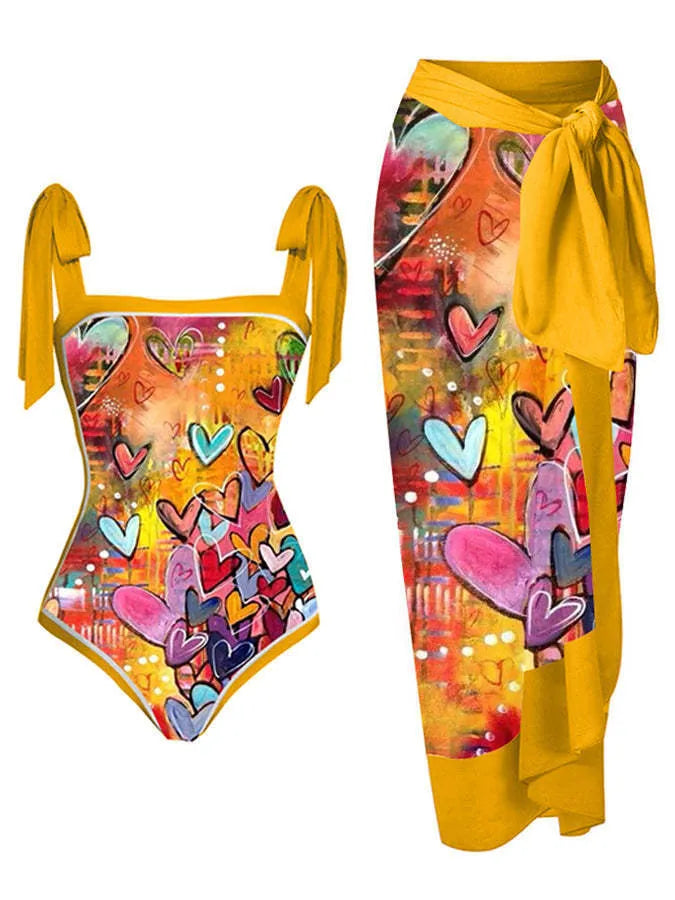 Women's floral print two-piece swimsuit with a sheer chiffon hip skirt, shown in one of the available colour variations.