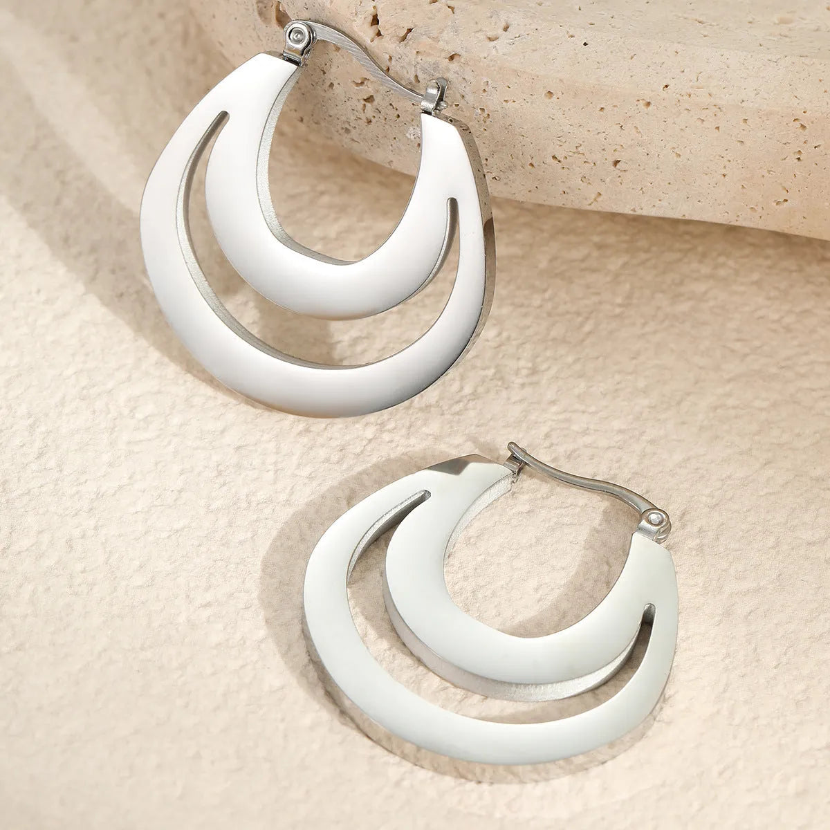 Geometric French earrings with circular ring design in gold and steel tone options