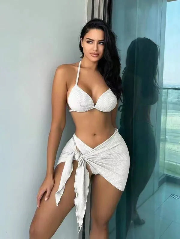 Women's sexy Russian split style three-piece swimsuit set in avocado green, laid flat showing top, panties, and skirt.