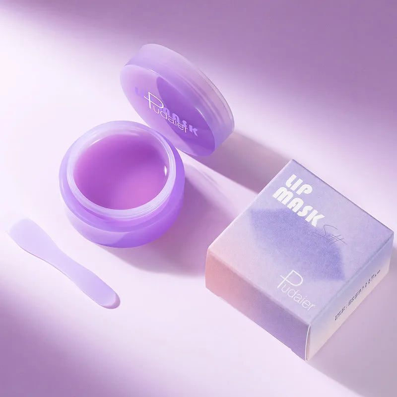 Box containing a 10ml lip exfoliating balm tube and a plastic lip skin scraper.