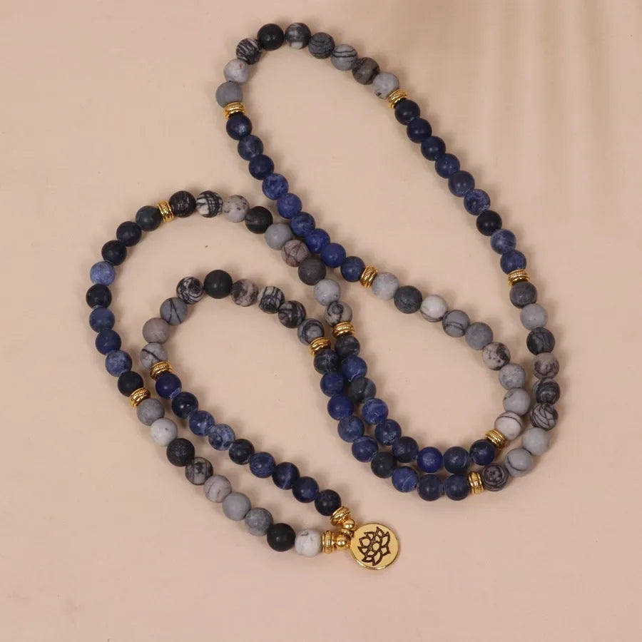 Multi-layer bracelet with blue patterned network stone beads on an alloy base, showing a fresh and sweet natural style.