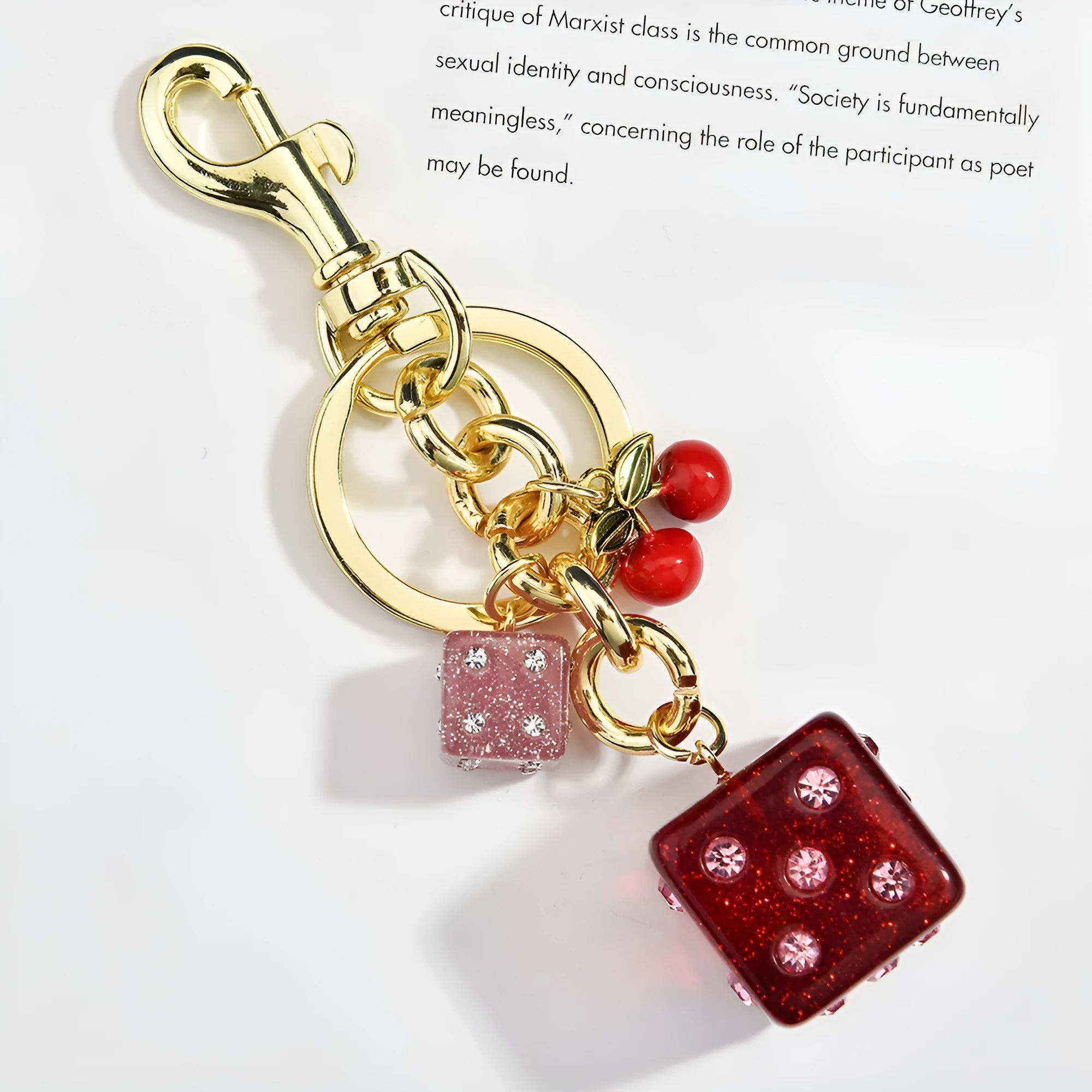 Square metal keychain pendant with cherry two-tone dice design and electroplated finish