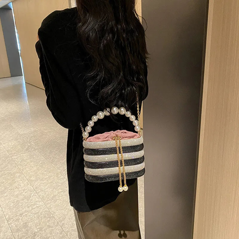 Women's crossbody bag with pearl beaded detailing in soft PU leather showing European retro style and single shoulder strap