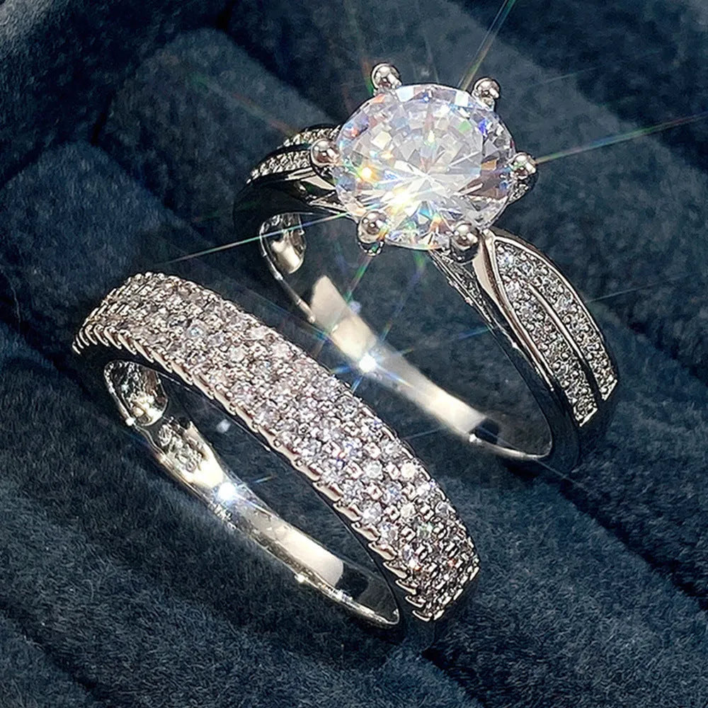 White gold colour wedding ring attached to matching bracelet with geometric shapes and round decorative elements