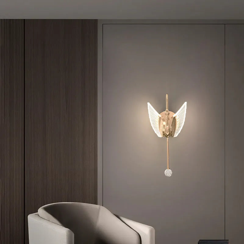 Gold swan-shaped wall lamp with acrylic shade and iron construction for bedroom lighting