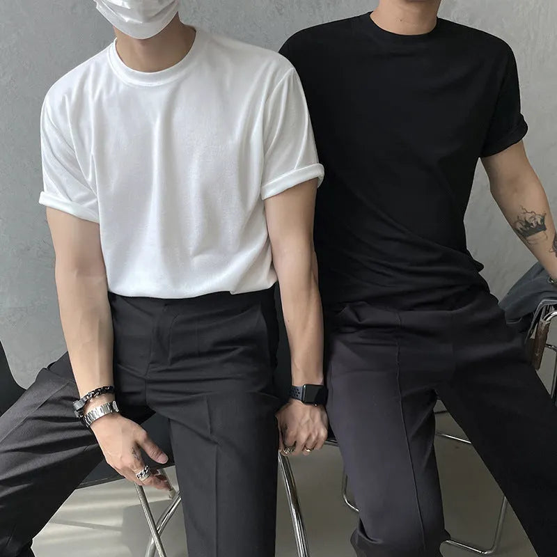 Men's slim fit black cotton t-shirt with round neck and half sleeves on a hanger