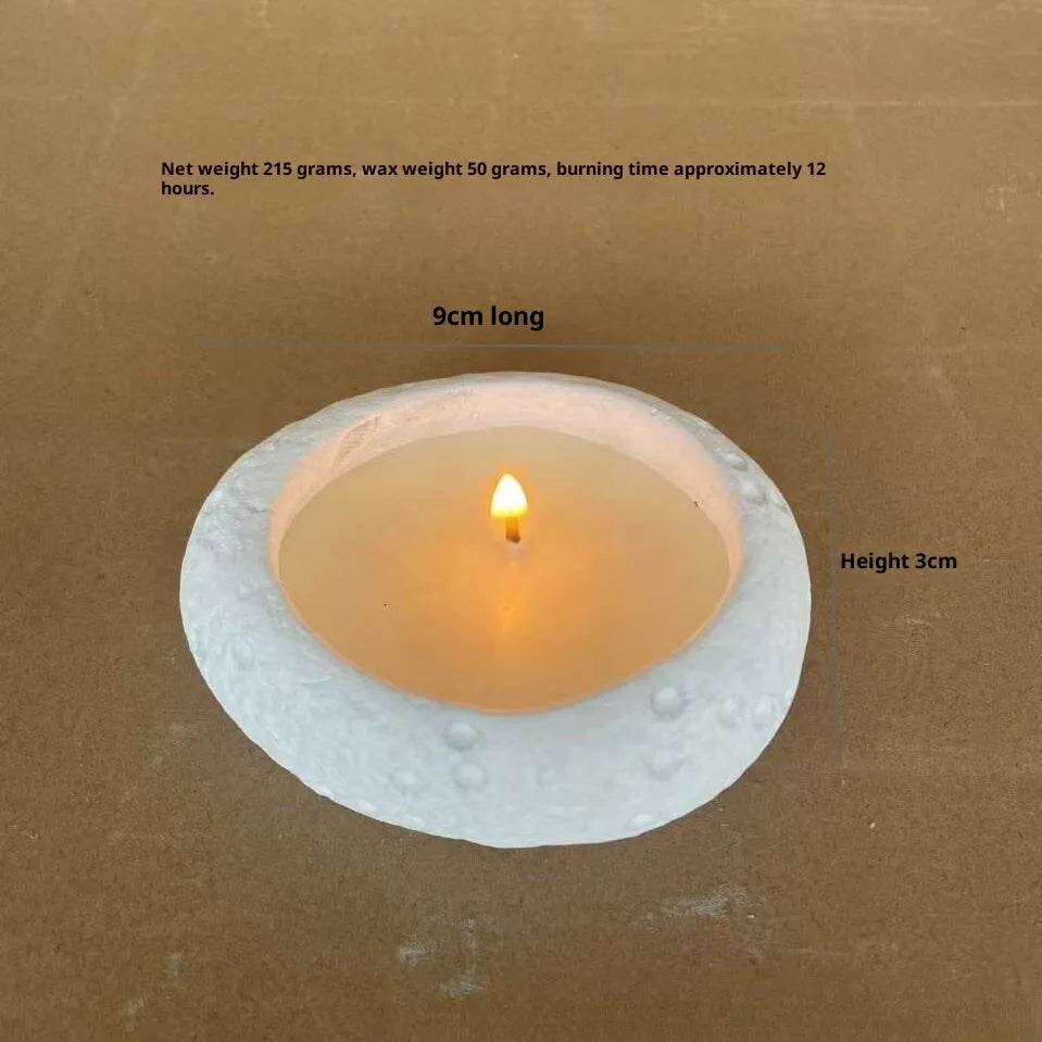 White cement fair-faced candlestick ornament for aromatherapy candles on a shelf