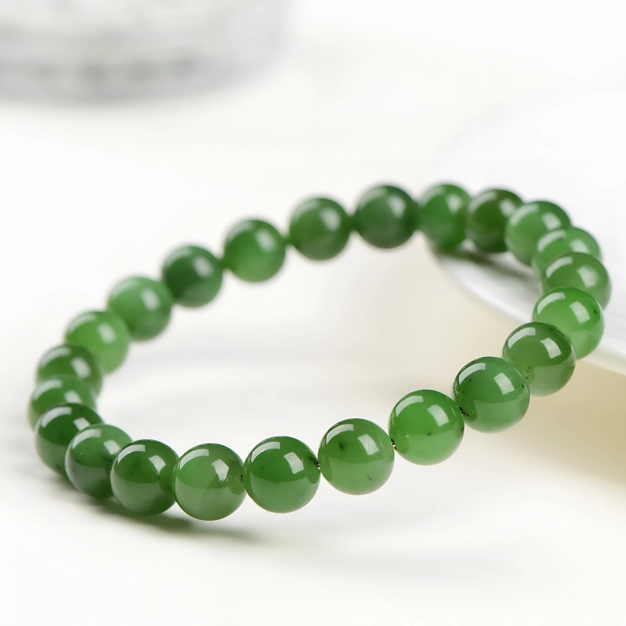 Natural Jasper and Hetian jade bead bracelet showing polished stone beads in one of five available sizes.