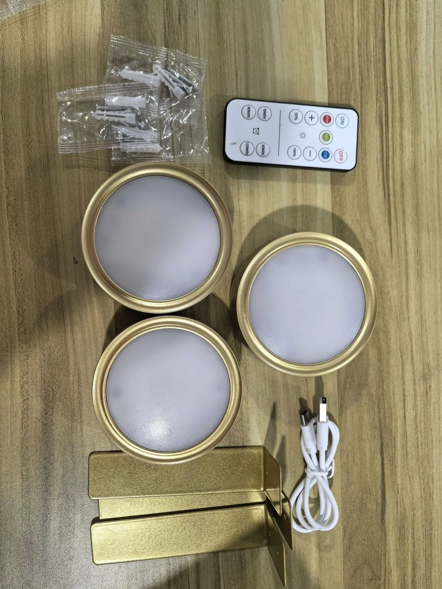 Wireless LED painting lamp with a magnetic mounting belt and remote control in black finish.