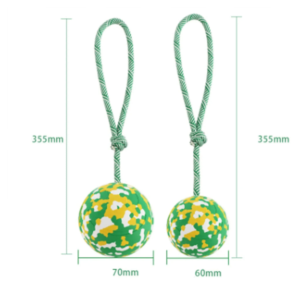 Natural rubber dog ball attached to a nylon rope toy for medium and small breeds