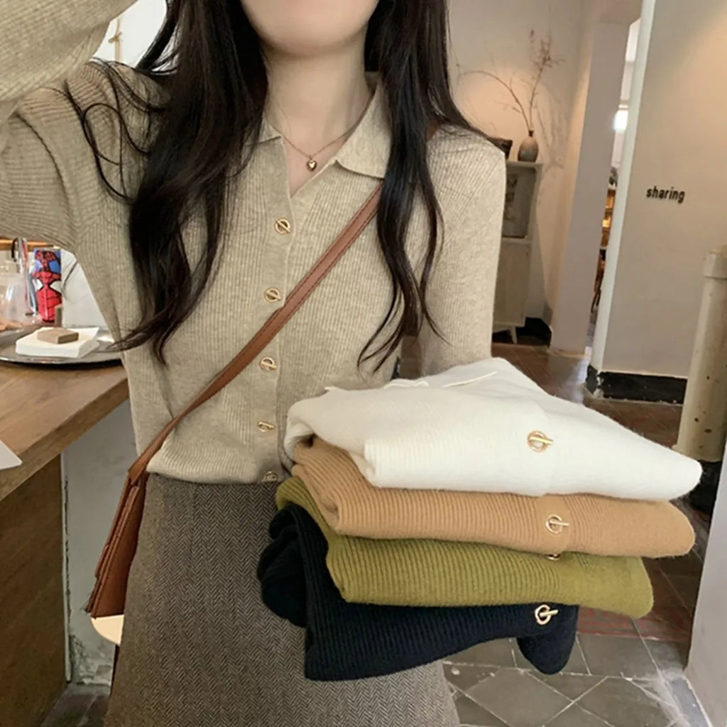 Loose fit knitted cardigan in beige, shown worn open as a long-sleeved top