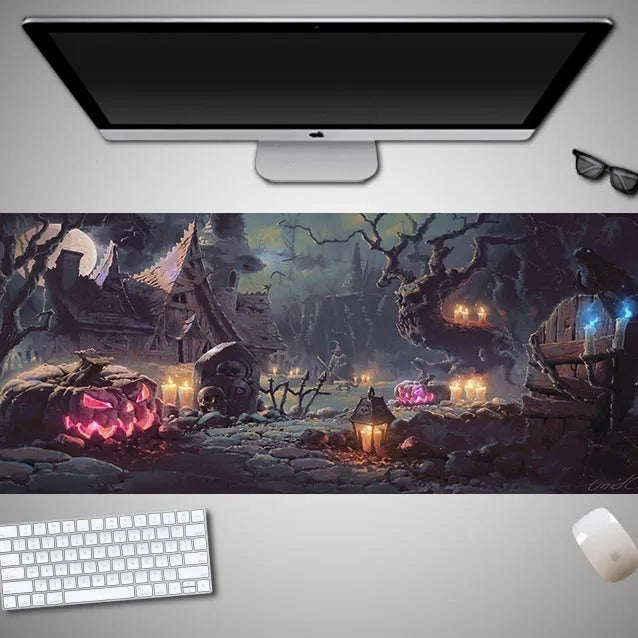 Oversized Halloween graphic cloth mouse pad on a desk, showing non-slip rubber base.