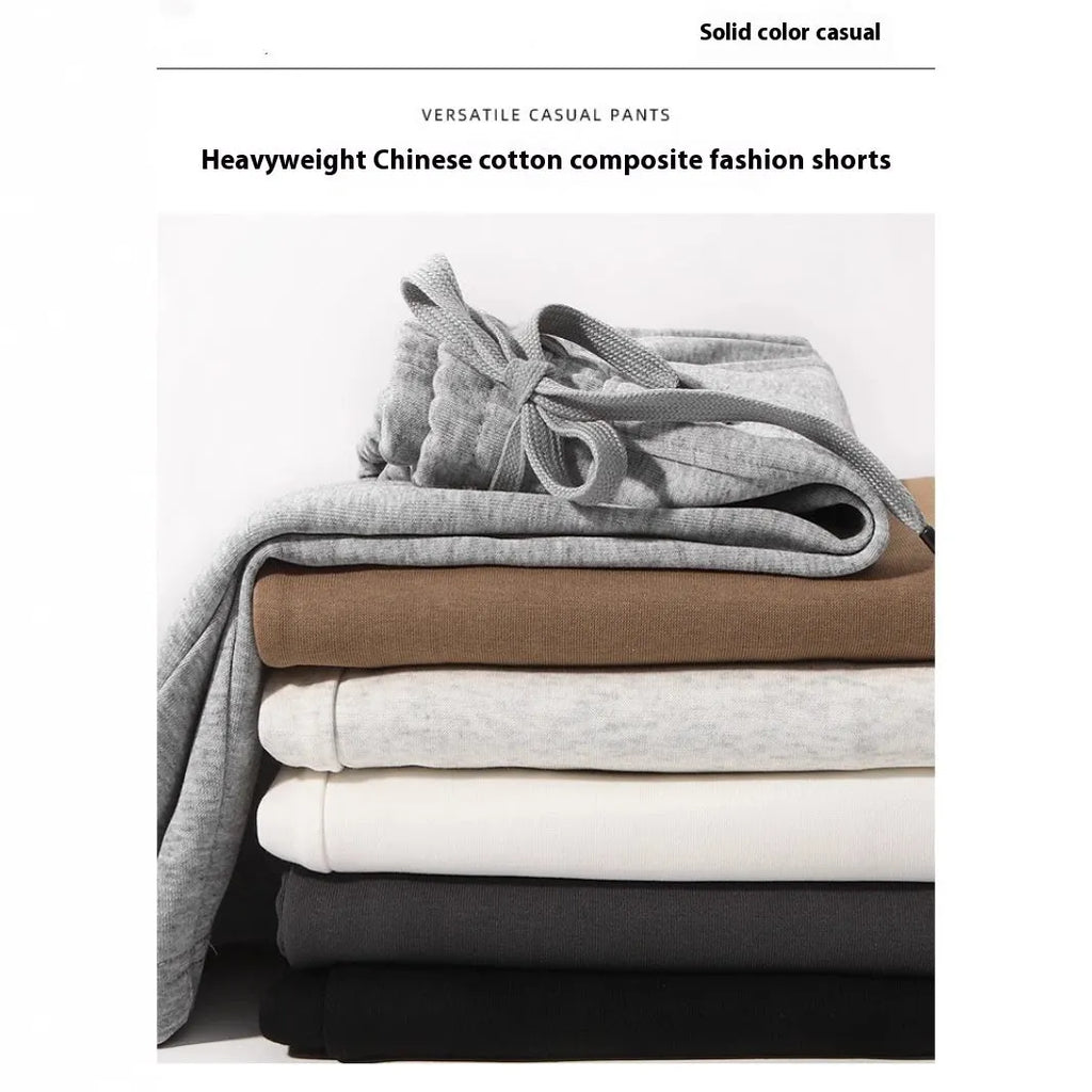 Straight-leg cotton sports shorts in light grey on a neutral background.