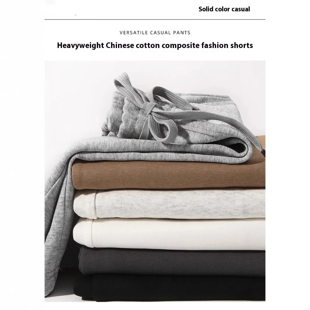 Straight-leg cotton sports shorts in light grey on a neutral background.