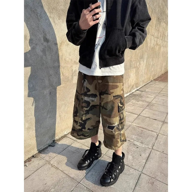 Men's loose straight leg jeans in camouflage colour with ripped patch details and a cropped ankle length