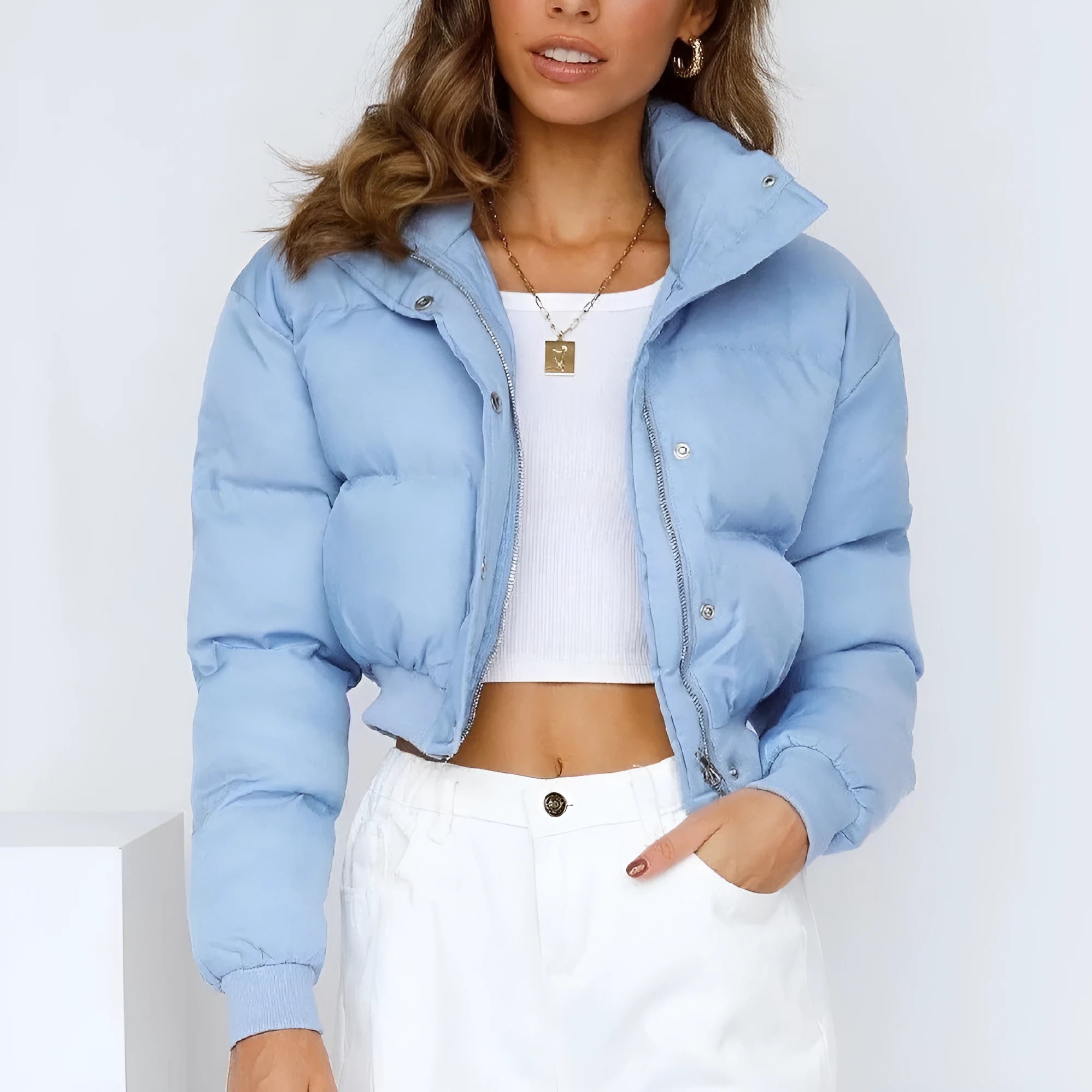 Women's loose-fit polyester jacket in blue, shown with long sleeves and a casual design.