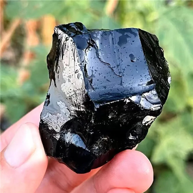 Natural black obsidian rough gravel stones in a pile, size 2-3cm each