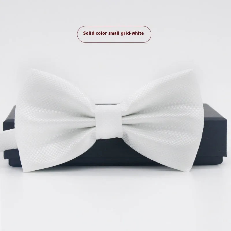 Solid colour flat head bow tie for formal wear in multiple colours including black, red, and blue.