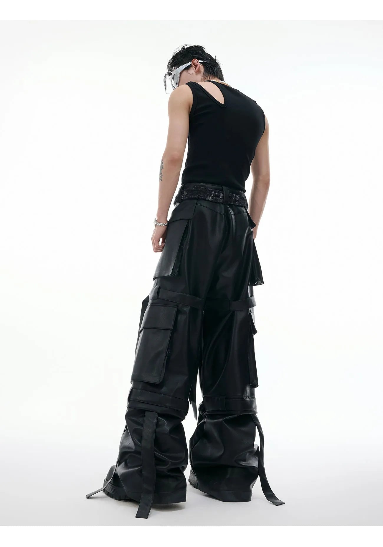 Black quilted leather trousers with multiple pockets and retro stitching details